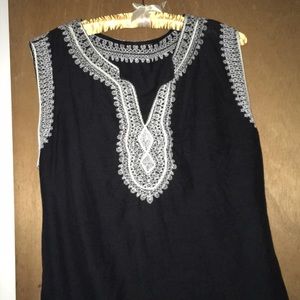 Black sleeveless shirt with white embroidery